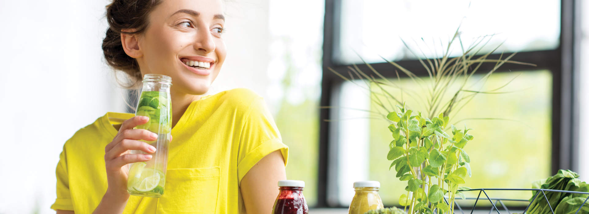 happy woman drinking a healthy drink