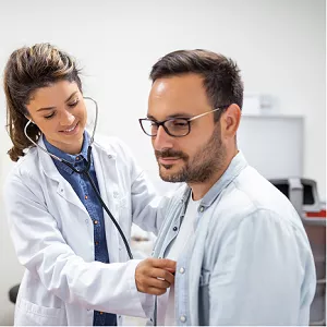 Man getting a check up at the doctor's office. 
