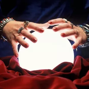 woman with hands on a glowing ball