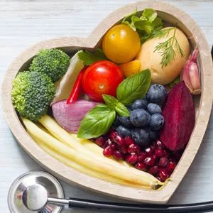 heart bowl with vegetables and fruits