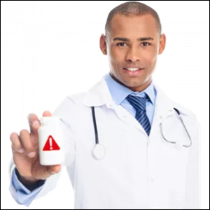 Pharmacist holding pill bottle. 