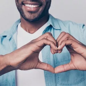 Man showing heart sign with hands