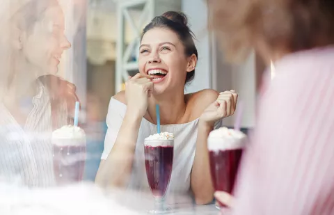 happy young woman enjoying a dessert