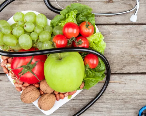 heart shaped plate full of fruit and vegetables