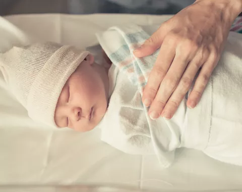 sleeping infant in NICU